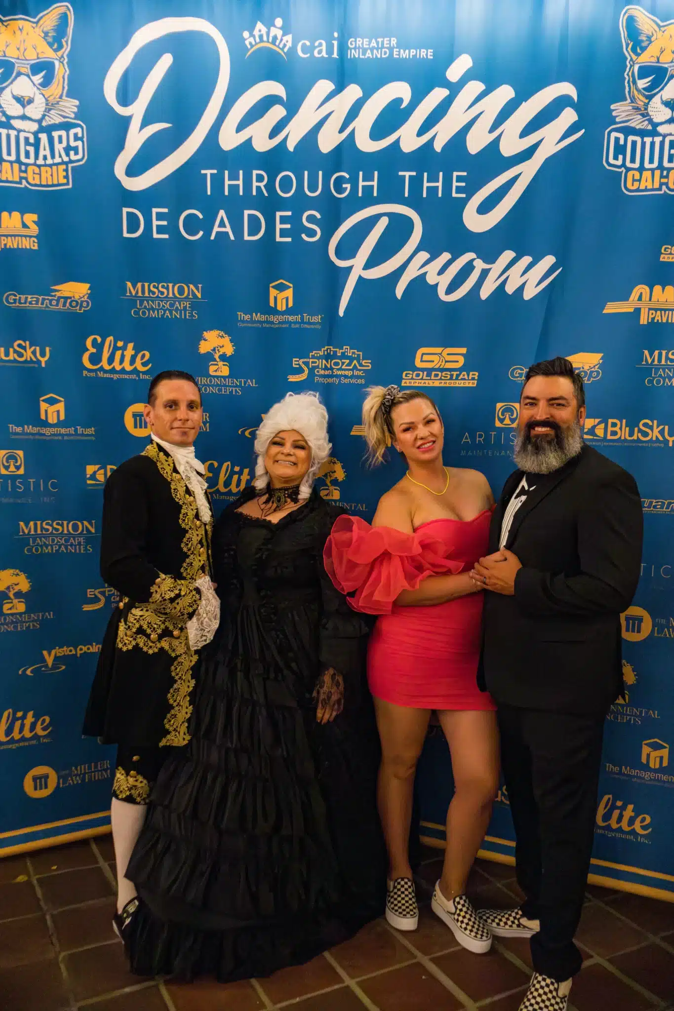 Guests posing at the Dancing Through the Decades Prom during 29PM roaming photography.