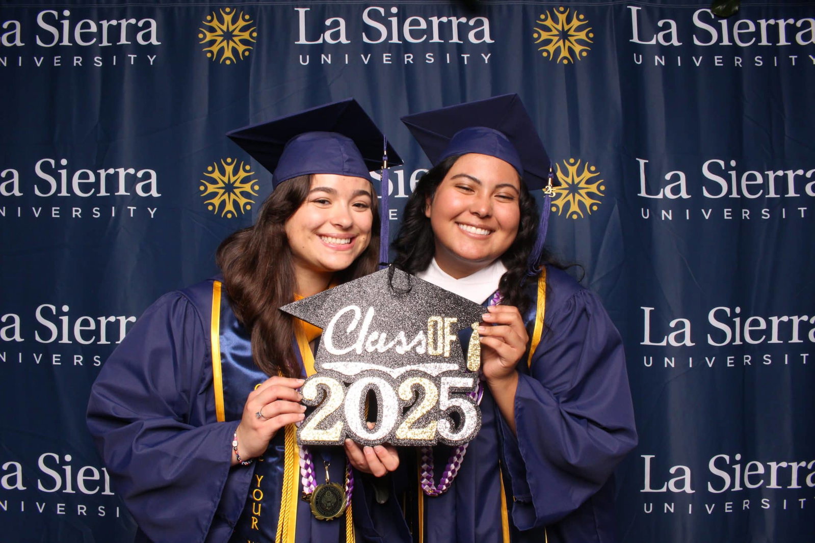 Graduates posing in the 29PM photo booth