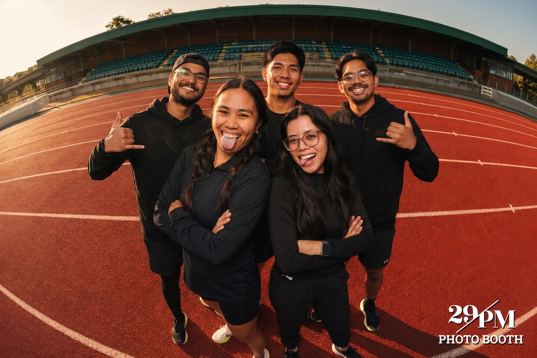 Five friends posing on a track in a custom 29PM AI photo experience