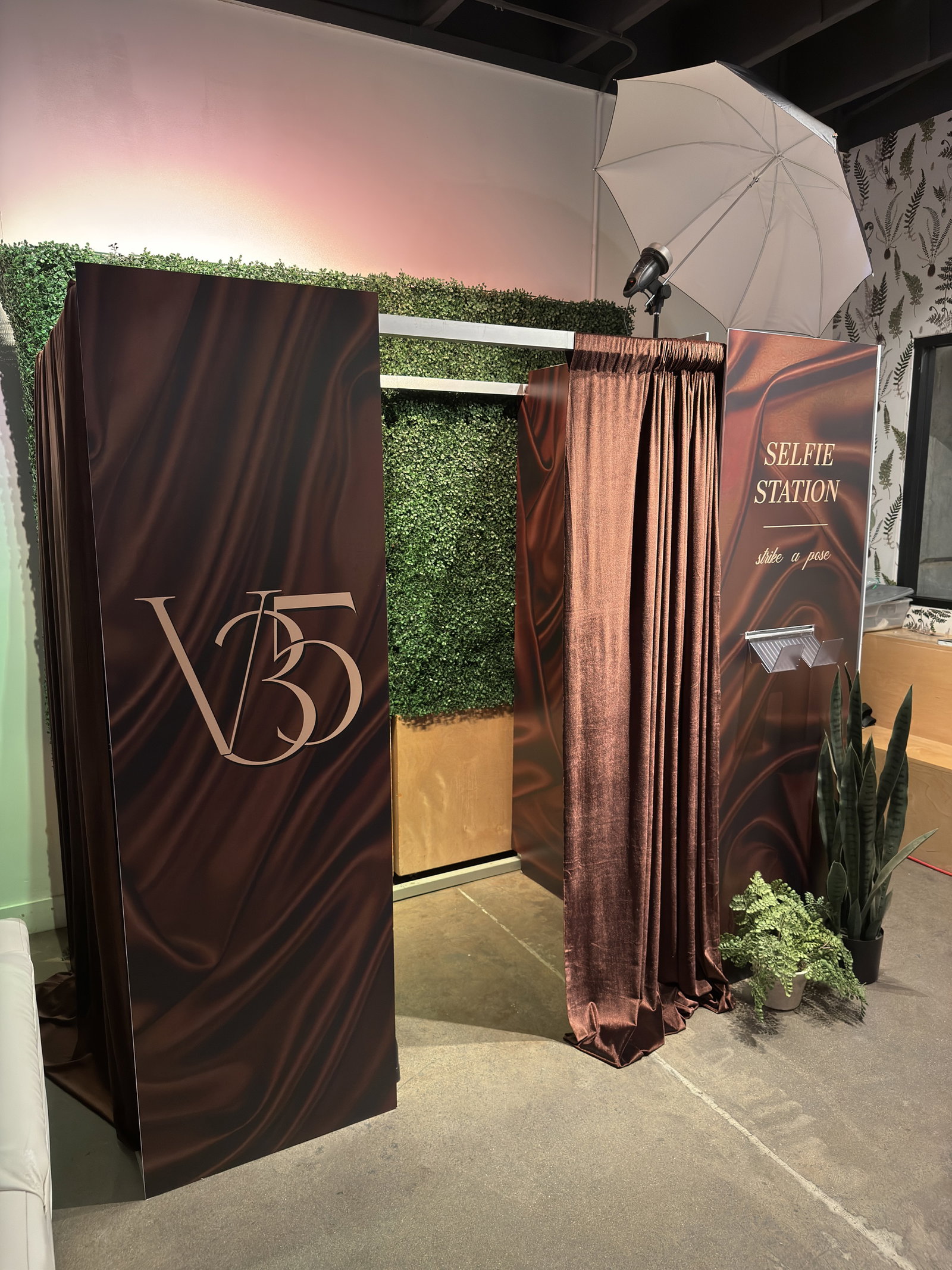 Custom-branded 29PM classic sit-down photo booth with burgundy curtains and selfie station