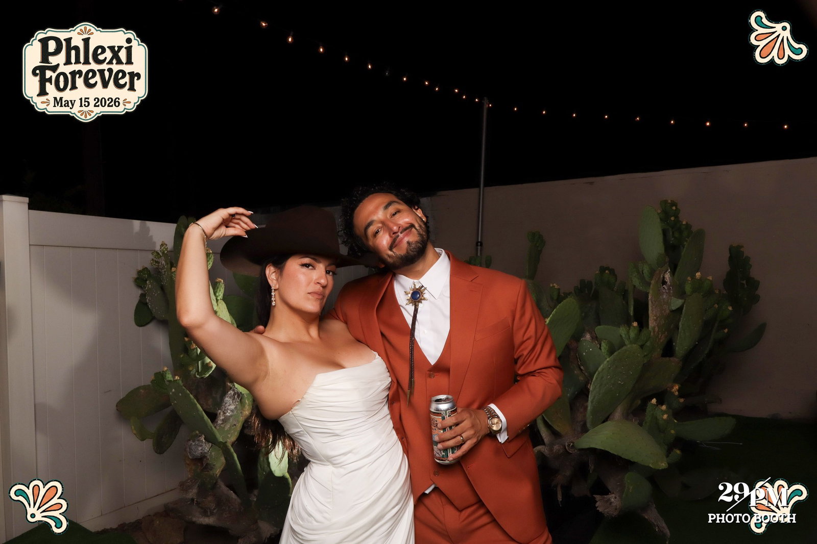 Newlyweds posing at their Phlexi Forever wedding photo booth