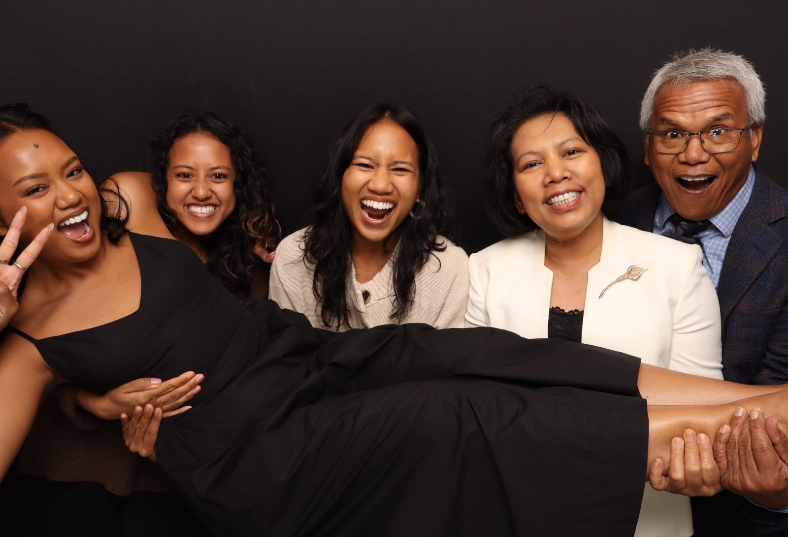 Multigenerational group laughing together in a 29PM Glam Booth portrait