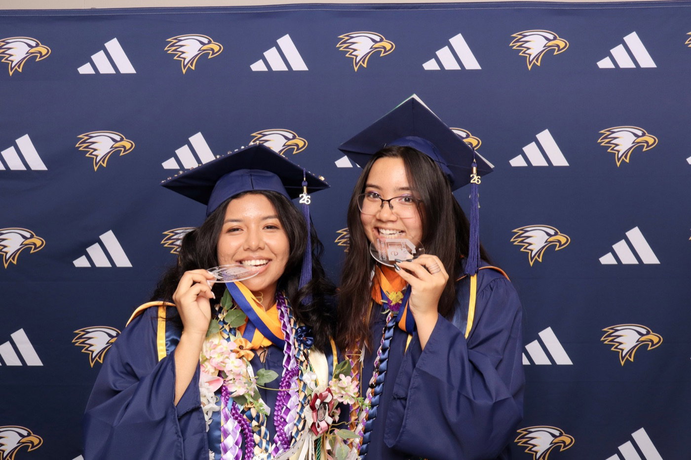 La Sierra University graduates celebrating at the photo booth