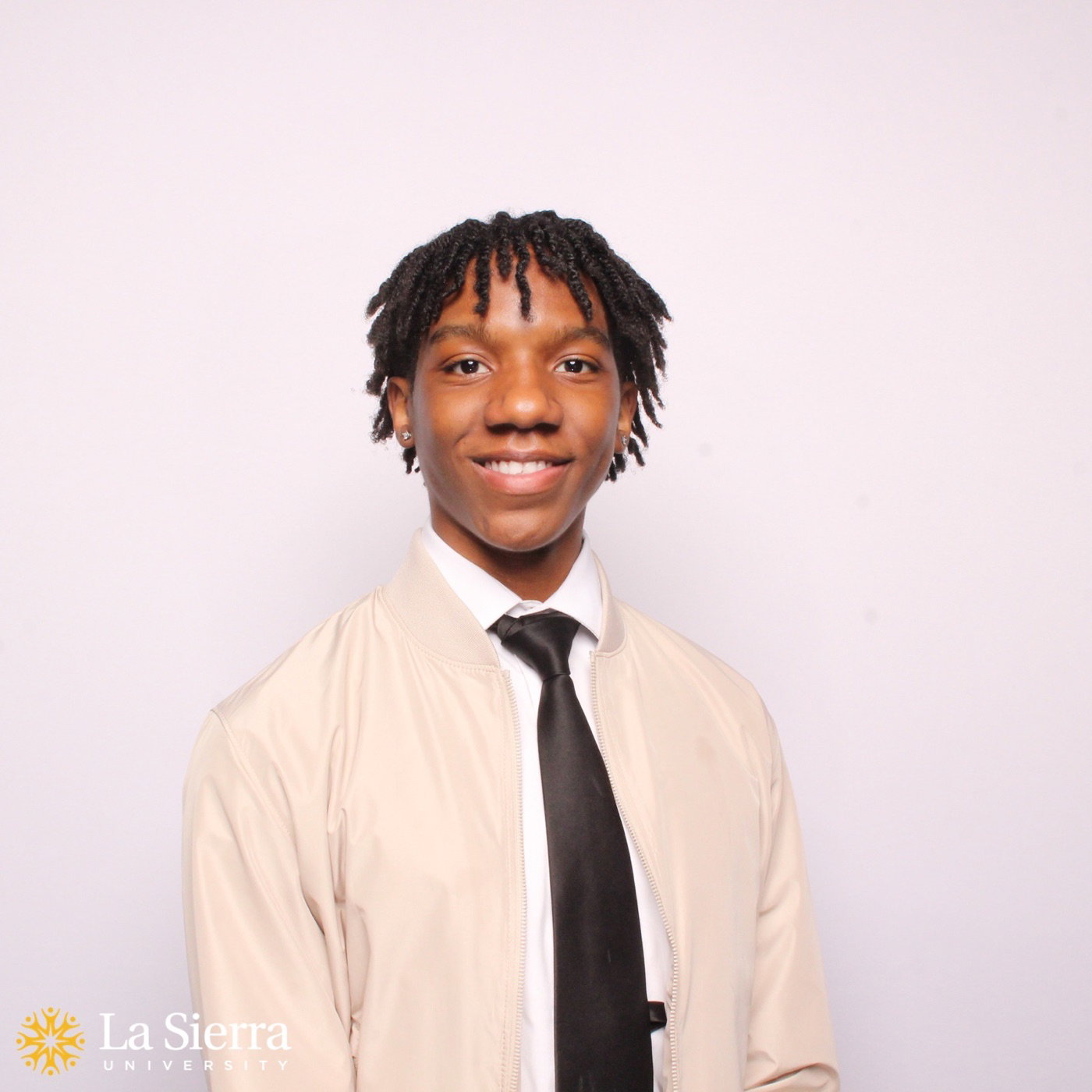 La Sierra University student portrait with school logo